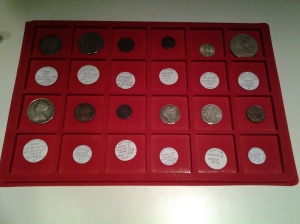 Tray of different historical Scottish coins.