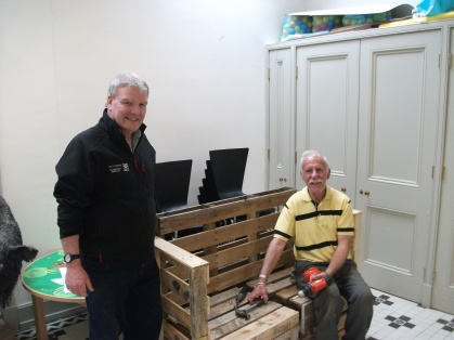 Roger with fellow volunteer Sandy working on a book bench!